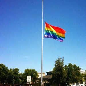 Rainbow flag of LGBTQ community at half mast